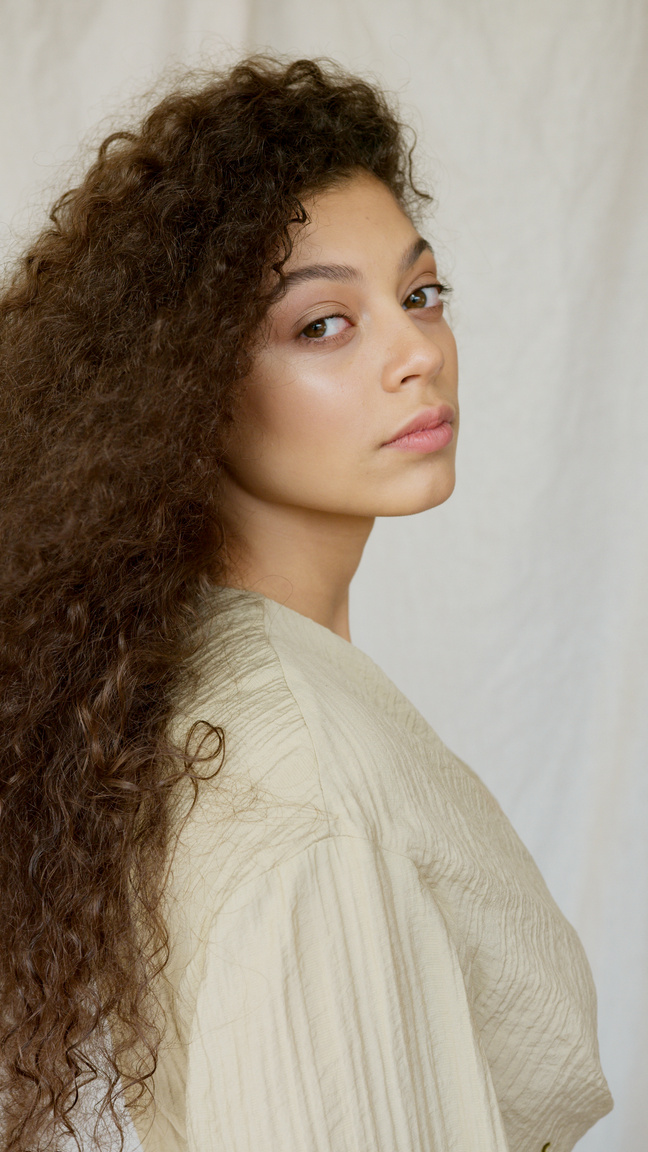 A Portrait of a Woman with Curly Hair 